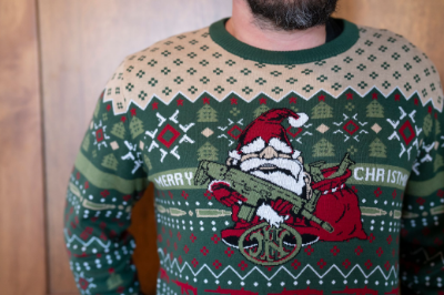 Image of a red and green Christmas sweater featuring an FN gnome